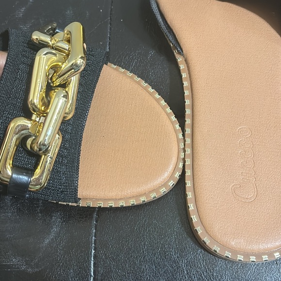 Black and gold slides in size 11. Gold buckle at the top and gold design around - Picture 3 of 4